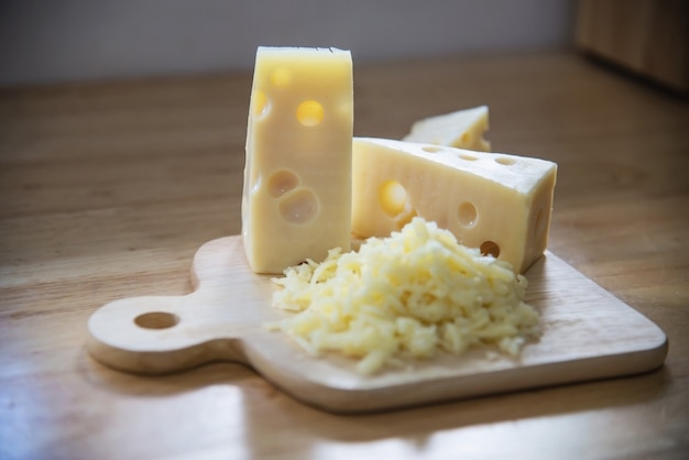 Free photo beautiful cheeses in the kitchen - cheese food preparing concept