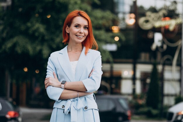 Beautiful classy woman in a blue suit