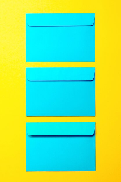 Beautiful Colorful Blue Envelops on Yellow Background, Fashion S