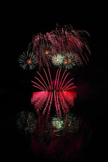 Beautiful colorful fireworks with reflections in water. Brno dam, the city of Brno-Europe. Internati