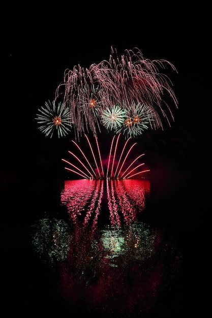 Beautiful colorful fireworks with reflections in water. Brno dam, the city of Brno-Europe. Internati