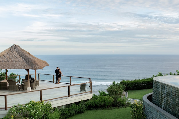 Free photo beautiful couple look at the ocean