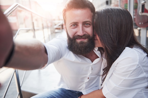 Free photo a beautiful couple makes a photo outdoors