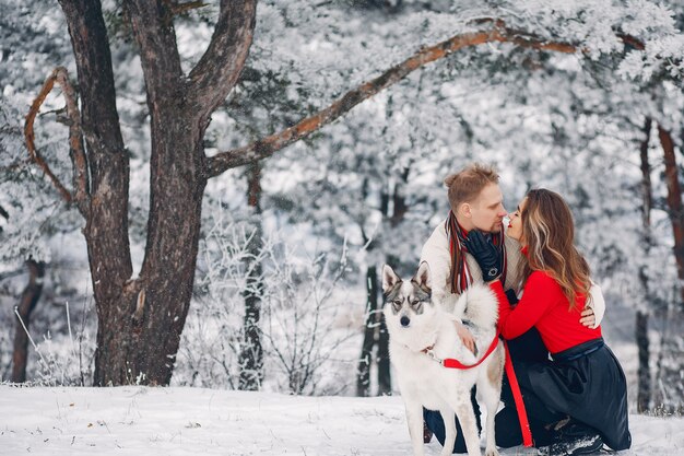 Beautiful couple playing with a dog