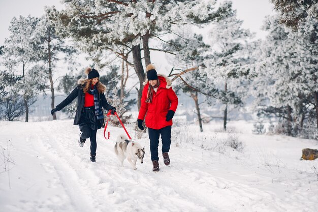 Beautiful couple playing with a dog