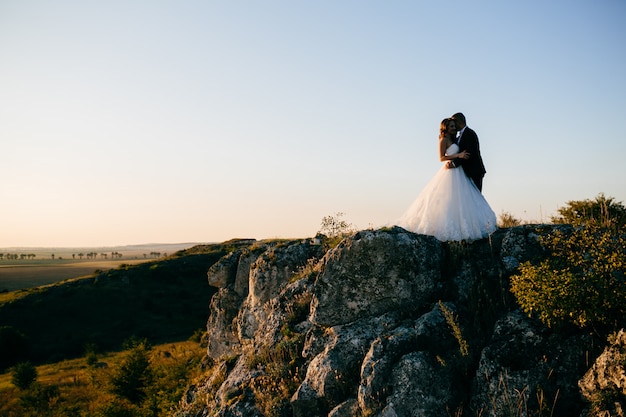 Free photo beautiful couple posing on their wedding day