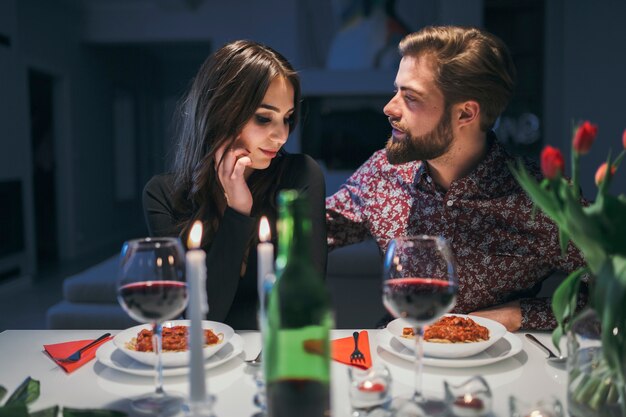 Beautiful couple relaxing at dinner