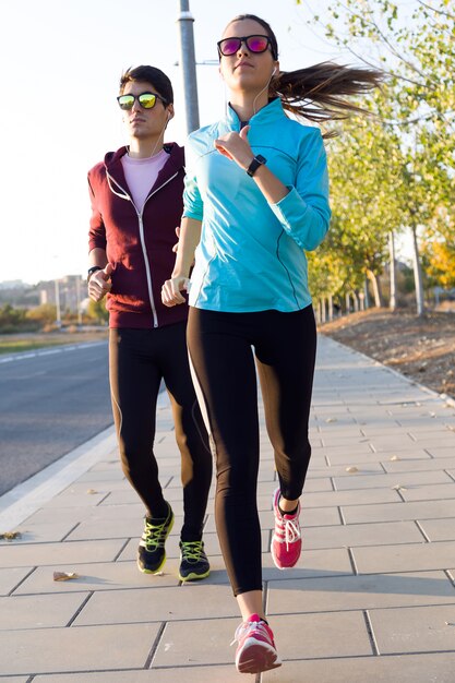 Beautiful couple running in the street.