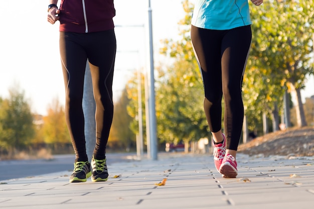 Beautiful couple running in the street.