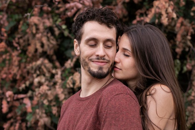 Beautiful couple showing love to each other outdoors