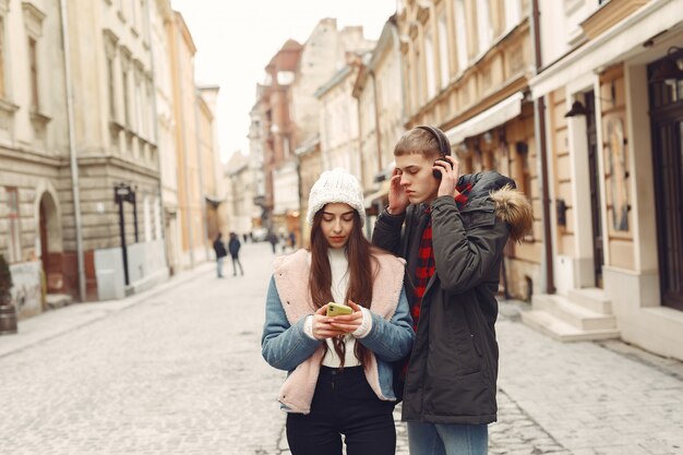 Beautiful couple spend time in a autumn city