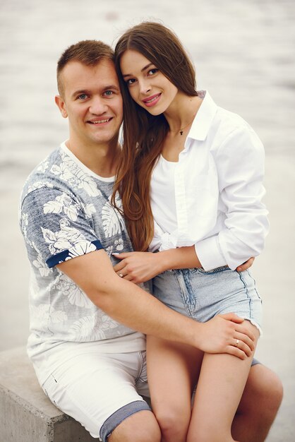 Beautiful couple spend time in a autumn cloudy park