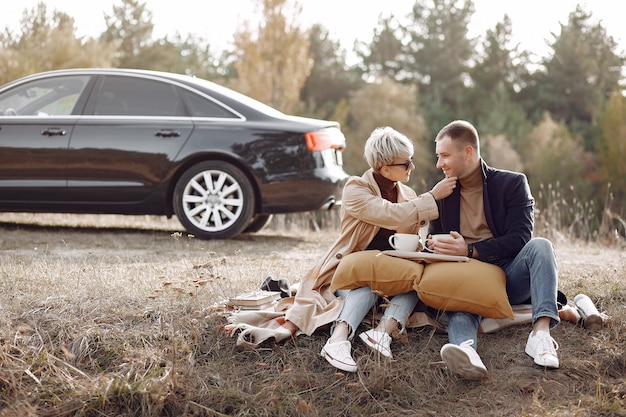 Free photo beautiful couple spend time on a autumn field