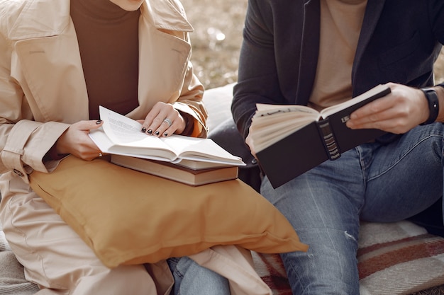 Beautiful couple spend time on a autumn field