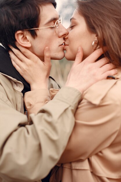 Beautiful couple spend time in an autumn field