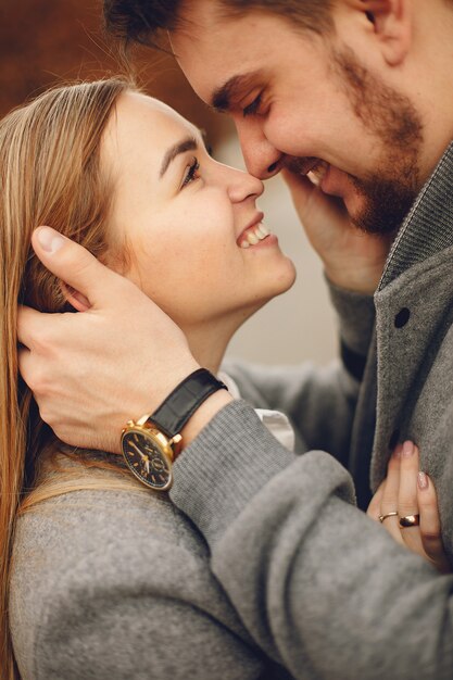 Beautiful couple spend time in a autumn park