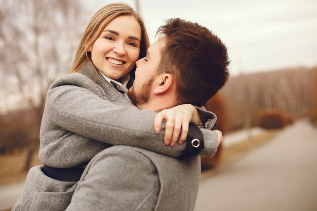 Free photo beautiful couple spend time in a autumn park