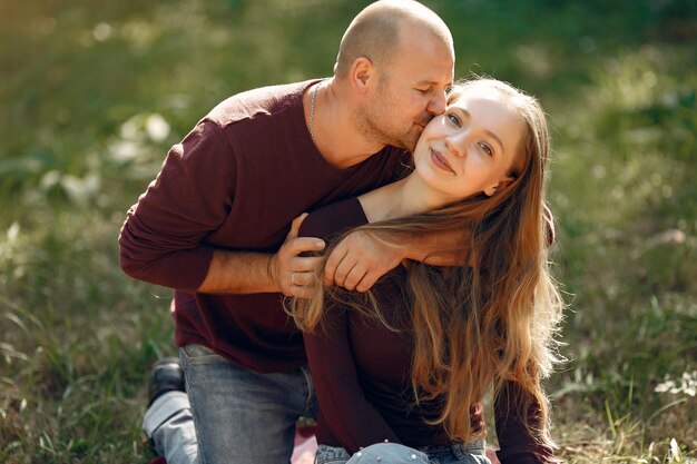 Beautiful couple spend time in a autumn park