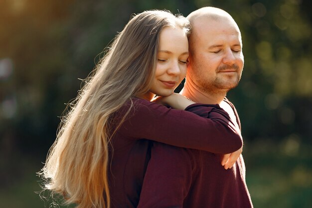 Beautiful couple spend time in a autumn park