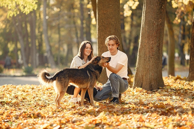 Beautiful couple spend time in a autumn park