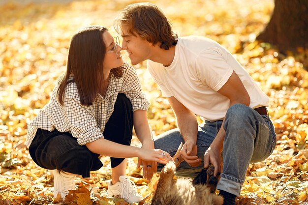 Beautiful couple spend time in a autumn park