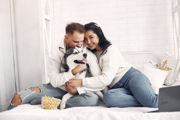 Beautiful couple spend time in a bedroom