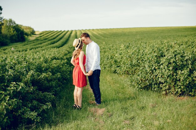 Beautiful couple spend time on a field