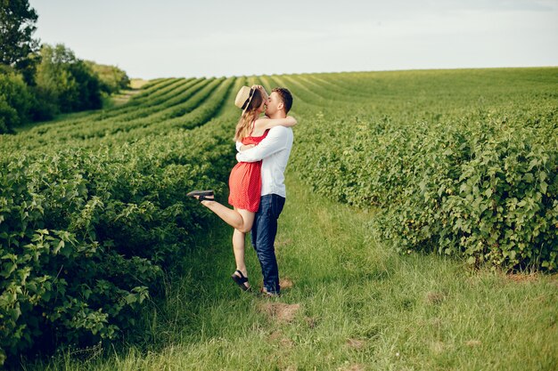 Beautiful couple spend time on a field