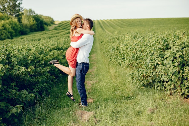 Beautiful couple spend time on a field