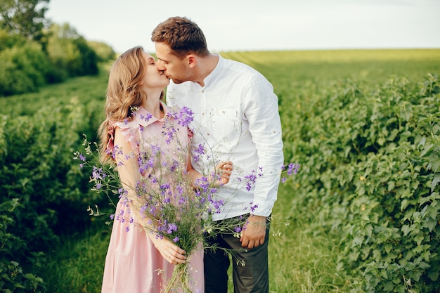 Beautiful couple spend time on a field