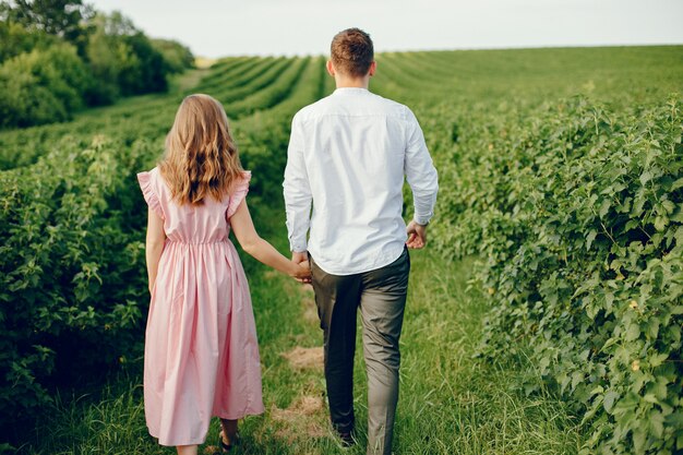 Beautiful couple spend time on a field