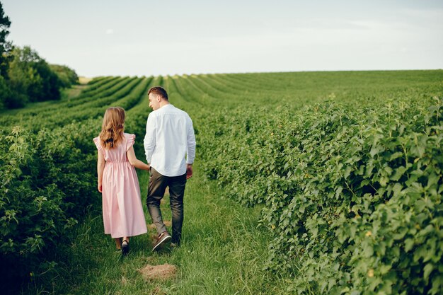 Beautiful couple spend time on a field