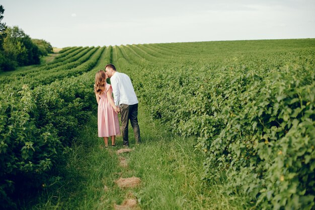 Beautiful couple spend time on a field