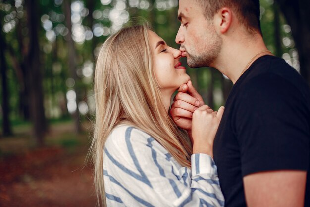 Beautiful couple spend time on a forest