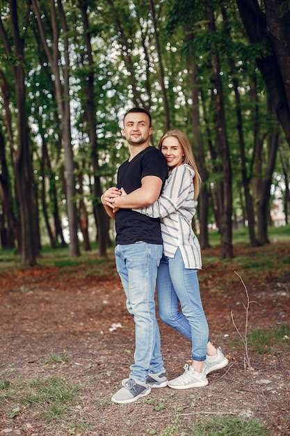 Beautiful couple spend time on a forest