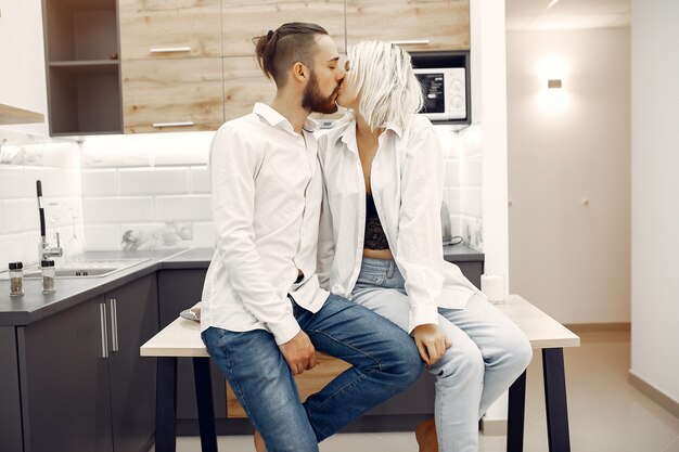 Beautiful couple spend time at home in the kitchen