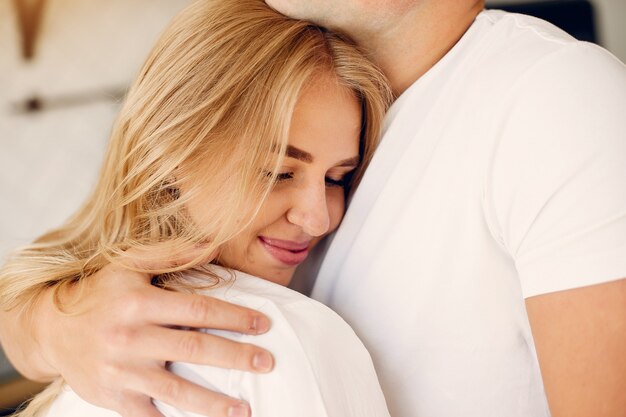 Beautiful couple spend time in a kitchen