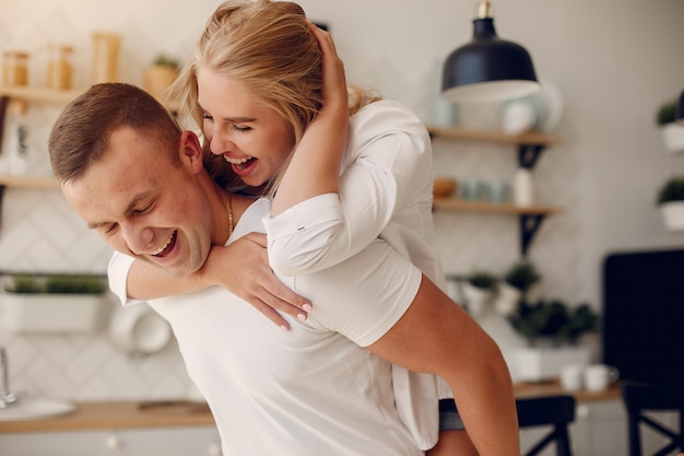 Beautiful couple spend time in a kitchen