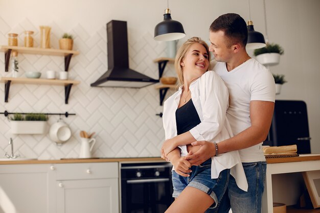Beautiful couple spend time in a kitchen