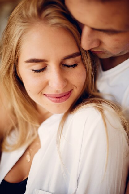 Beautiful couple spend time in a kitchen