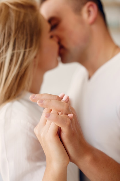 Beautiful couple spend time in a kitchen