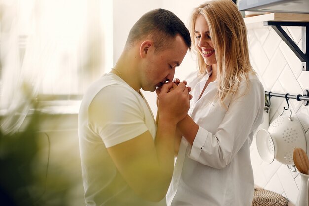 Beautiful couple spend time in a kitchen