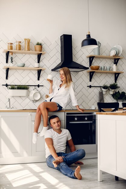 Beautiful couple spend time in a kitchen