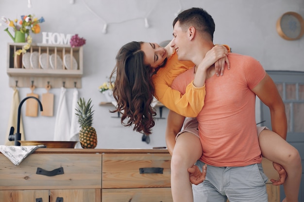 Beautiful couple spend time in a kitchen