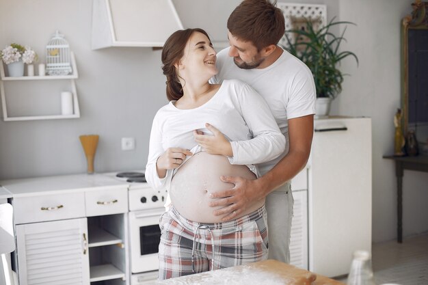 Beautiful couple spend time in a kitchen