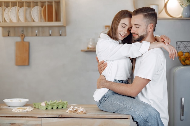 Beautiful couple spend time in a kitchen