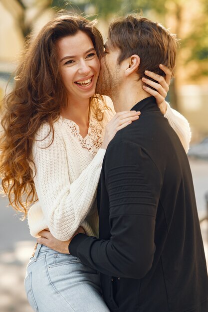 Beautiful couple spend time in a spring city