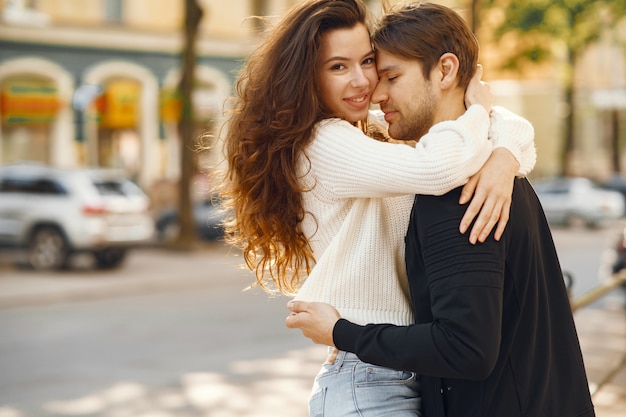 Beautiful couple spend time in a spring city