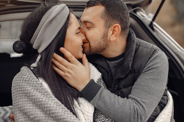 Beautiful couple spend time in a spring field