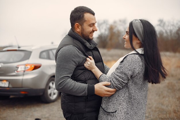 Beautiful couple spend time in a spring field